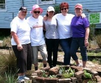 Volunteers with the herbal spiral that they created